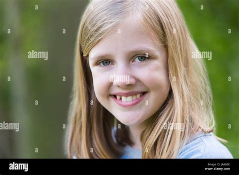 Portrait Of Smiling Pre Teen Girl Outdoors Stock Photo Alamy