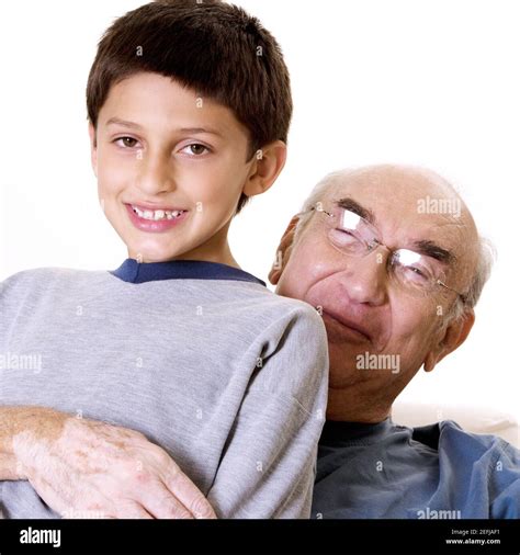 Portrait Of A Grandfather Hugging His Grandson Stock Photo Alamy