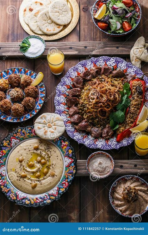 Middle Eastern Or Arabic Dishes And Assorted Meze On A Dark Background
