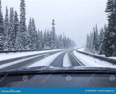 Car Driving On Snow Covered Snowy Mountain Road In Winter Snow Driver
