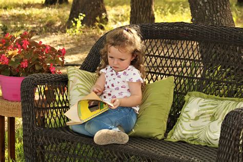 Little Girl Reading Book Outside Free Stock Photo Public Domain Pictures