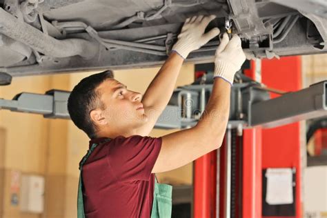 Young Auto Mechanic Repairing Car In Service Center Stock Image Image