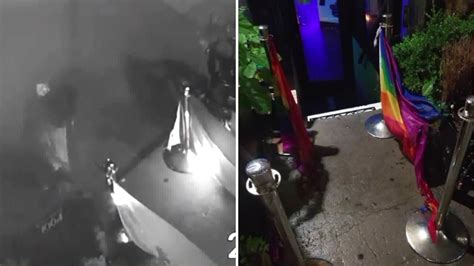 new video of man setting fire to lgbtq pride flags outside harlem bar