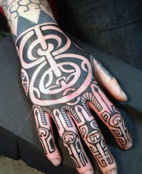 Whether you want a tribal tattoo on your sleeve, shoulder, arm, forearm, chest, back, or leg, you'll love our collection of pictures below! 40 Tribal Hand Tattoos For Men - Manly Ink Design Ideas
