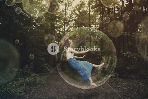 A Woman Is Falling And Stuck Inside A Bubble Royalty Free Stock Image