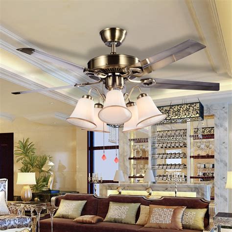 Although it doesn't have extravagant blades, it does it is basically a ceiling fan with the elegant lighting fixture. Modern Ceiling Fan Light For Living Room Restaurant ...