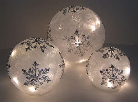 This Set Of Lighted Snowflake Glass Globes Will Add Sparkle And Shine