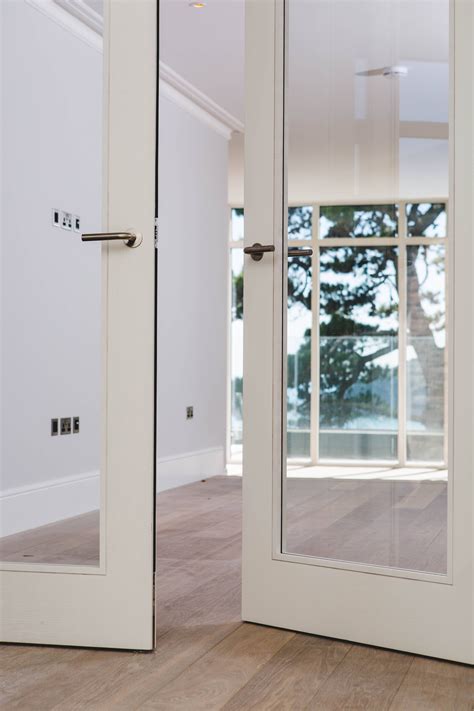 Contemporary White Washed Ash Veneer Trinity Style Double Doors With Large Vision Panels By Grae