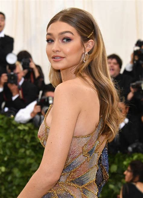 Gigi Hadid At The Met Gala With Long Sleek Center Parted Hair Secured With Bobby Pins And