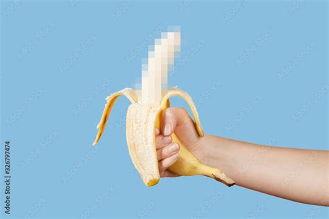Hidden Censored Banana In Hand On A Blue Background Horny Aroused