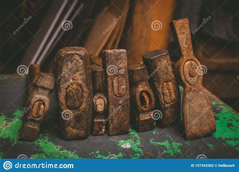 Set Of Old Hammers And Rusty Nails Tools On Metal The Surface Stock