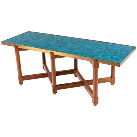An old metal coffee table is given a rustic hacienda look with tile and wood. Dunbar Murano Glass Tile Top Coffee Table by Edward ...