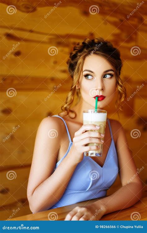 Girl In A Blue Dress Drinking Cappuccino Stock Photo Image Of