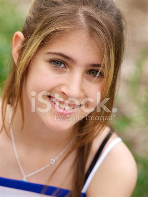 Pretty Smiling Teenage Girl Sitting In Front Of The White Sexiezpix