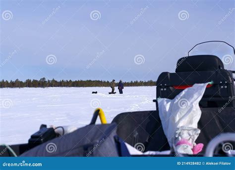 Fishermen Fishing On Frozen Lake Winter Frosty Morning Fishing On