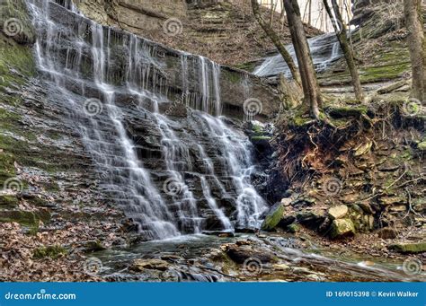 Waterfall Flowing Over Aged And Mossy Grey Rocks Stock Photo Image Of