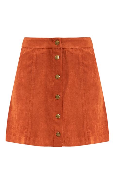 carmelita rust suede button front skirt prettylittlething