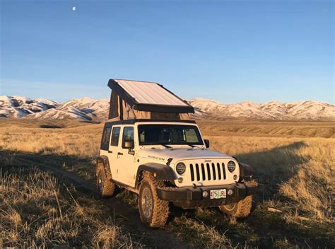 Leer's industry exclusive cync™ latching system allows easily opening the cover with two fingers from either side of the truck bed. Jeep Wrangler Camper Shell - Top Jeep