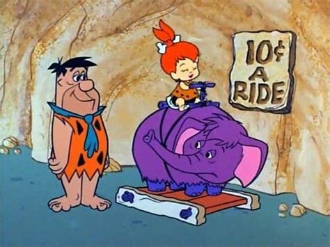 Fred Letting Pebbles Take A Ride Flintstone Cartoon Flintstones