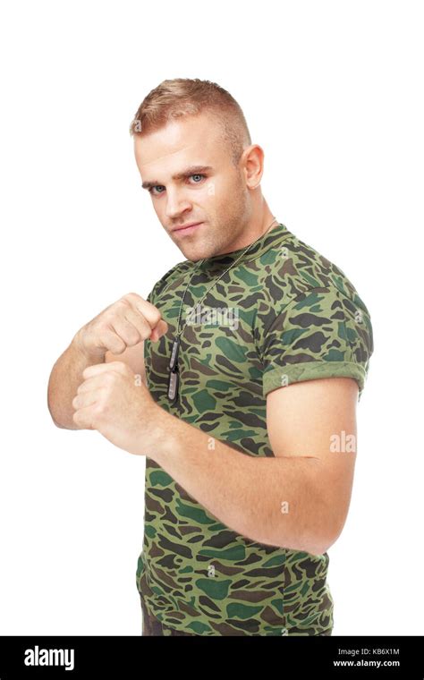 Portrait Of Young Army Soldier In Fighting Stance Isolated On White