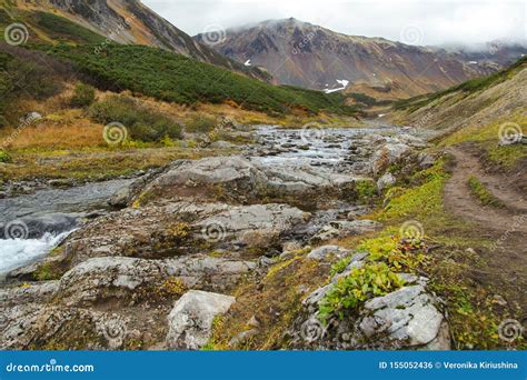 Beautiful Waterfall In Mountains Scenic Autumn Landscape In Kamchatka