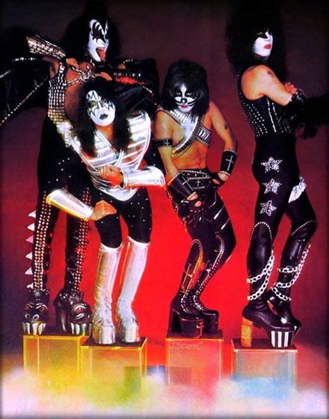 The Kiss Band Posing For A Photo In Their Costumes