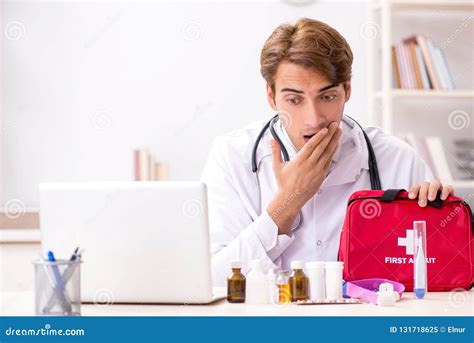 The Young Doctor With First Aid Kit In Hospital Stock Image Image Of