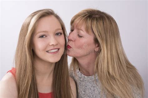 Mature Woman Kissing A Teenage Girl Stock Image Image Of Women