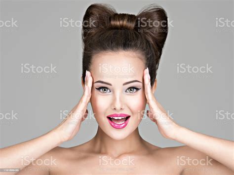 Fun Face Of A Pretty Woman With Creative Hairdo Stock Photo Download