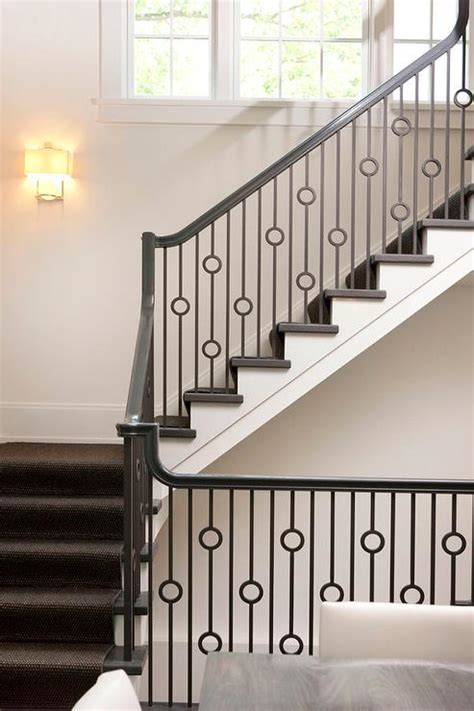 Stair spindles installation costs are commonly quoted from a standard rate and can be estimated/quoted by the service professional after measurement and visual inspection at the job site. Staircase with Iron Circles Spindles - Transitional ...