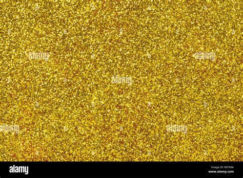 Golden Sparkling Background From Small Sequins Closeup Brilliant