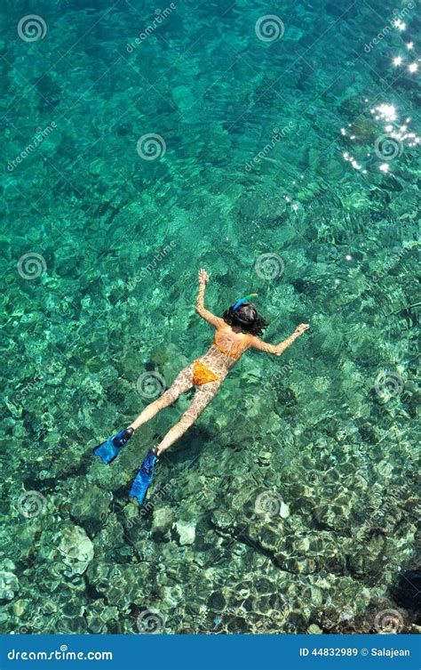 Woman Snorkeling In The Sea In Orange Bikini Stock Image Image Of Ocean Ripple