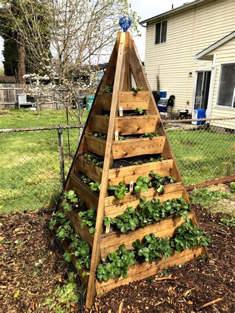 This raised garden bed has an outer frame built of wood with the center of the planter made from corrugated metal. How to Build the Tesla of Raised Bed Planters, The ...