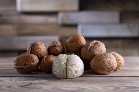 Premium Photo Walnuts Like Healthy Food For The Brain Shape Of Human Brain Is Surrounded By