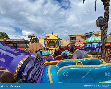 People Riding Big Thunder Mountain Railroad Rollercoaster At Disney