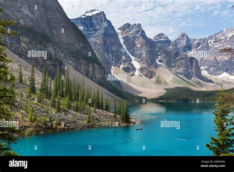 Beautiful Turquoise Waters Of The Moraine Lake With Snow Covered Peaks