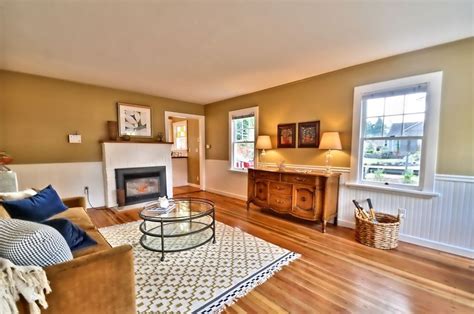 You can add even more interest when you choose to decorate the chair rail with something extraordinary. Contemporary Living Room with Laminate floors & Chair rail ...