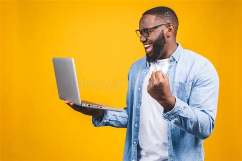 Excited Happy Afro American Man Looking At Laptop Computer Screen And