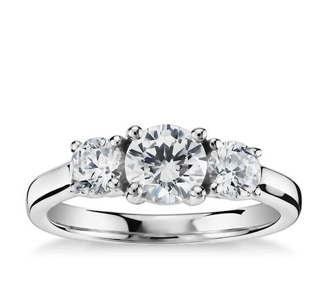 A three stone design is a classic expression of a couple's journey, as each stone represents their past, present, and future. Classic Three-Stone Diamond Engagement Ring in Platinum | Blue Nile
