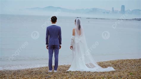 Beautiful Bride And Groom Holding Hands By The Beach Background And