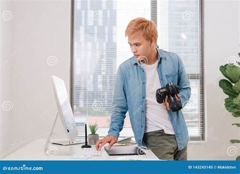Photographer Working At Desk In Modern Office Stock Photo Image Of