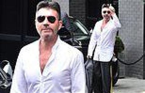simon cowell shows off his slim physique in an oversized shirt trends now