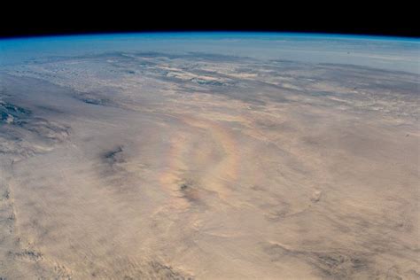 Astronaut Basks In Earths Glory Rainbow From Space Station Photo