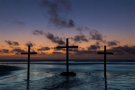 Cross On The Beach At Sunset Stock Photos Pictures And Royalty Free