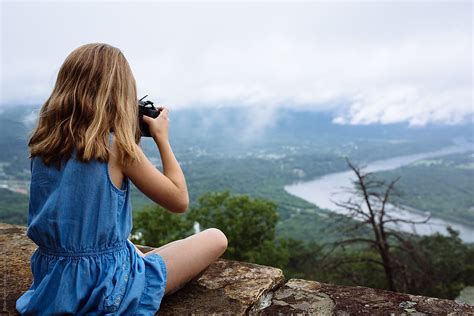 Girl Photographing From Mountain By Stocksy Contributor Brian Powell