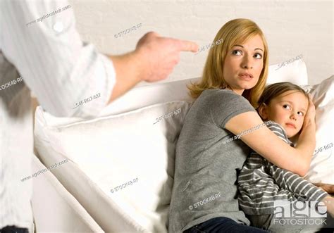 Mother Protecting Daughter From Violent Father Stock Photo Picture