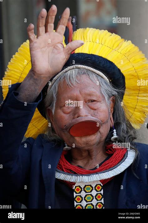Kayapo Tribal Leader Raoni Metuktire Waves As He Arrives For A Meeting With French President