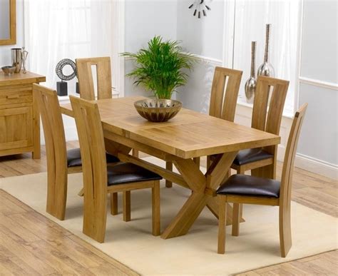 Thane 32'' pedestal dining table. 20 Photos Round Extending Oak Dining Tables and Chairs ...