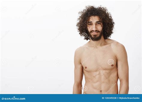 Portrait Of Masculine Confident Handsome Male With Curly Hair Standing