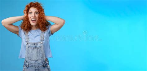 Excited Amused Joyful Redhead Curly Girl Having Amazing Perfect News